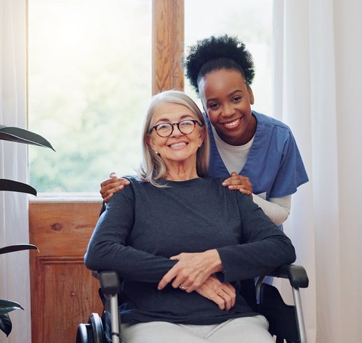 Professional caregiver delivering elderly care at home near me with personalized support for daily living activities.