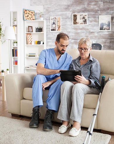 Professional caregiver assisting seniors through senior home care services near me in a safe home setting.