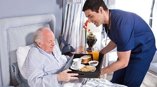 Compassionate caregiver offering elderly care at home near me to improve comfort and quality of life.