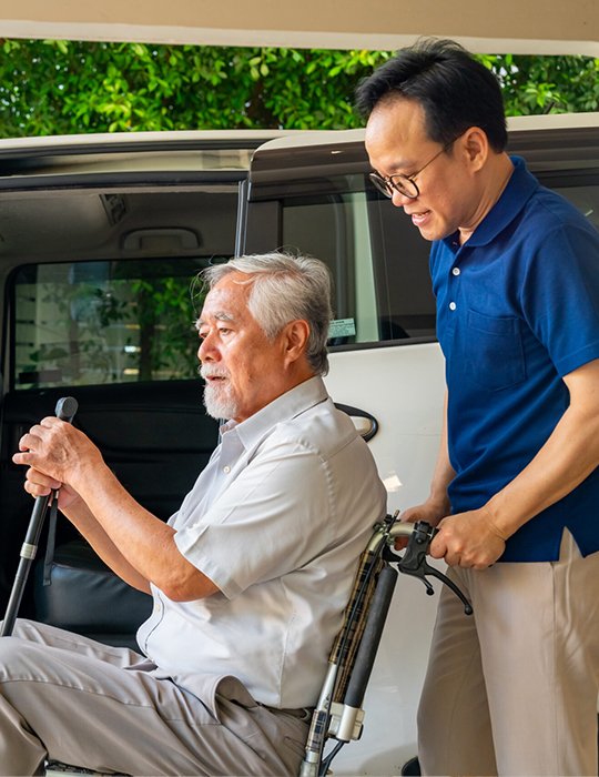 Compassionate caregiver assisting an older adult through in-home care for elderly near me services.