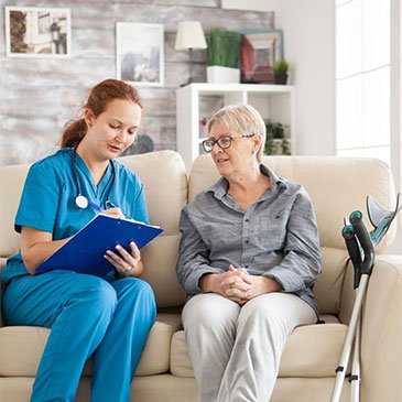 Professional caregiver assisting older adults through senior home care services near me.