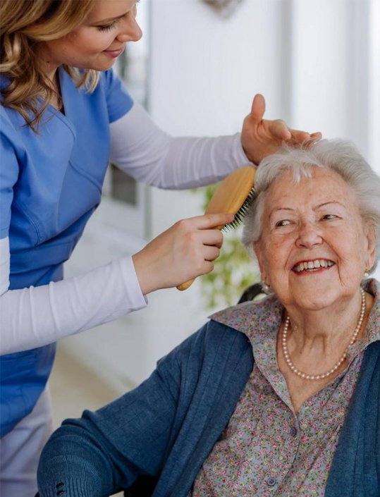 Professional caregiver assisting a senior at home with daily activities through home care services Marin County CA.
